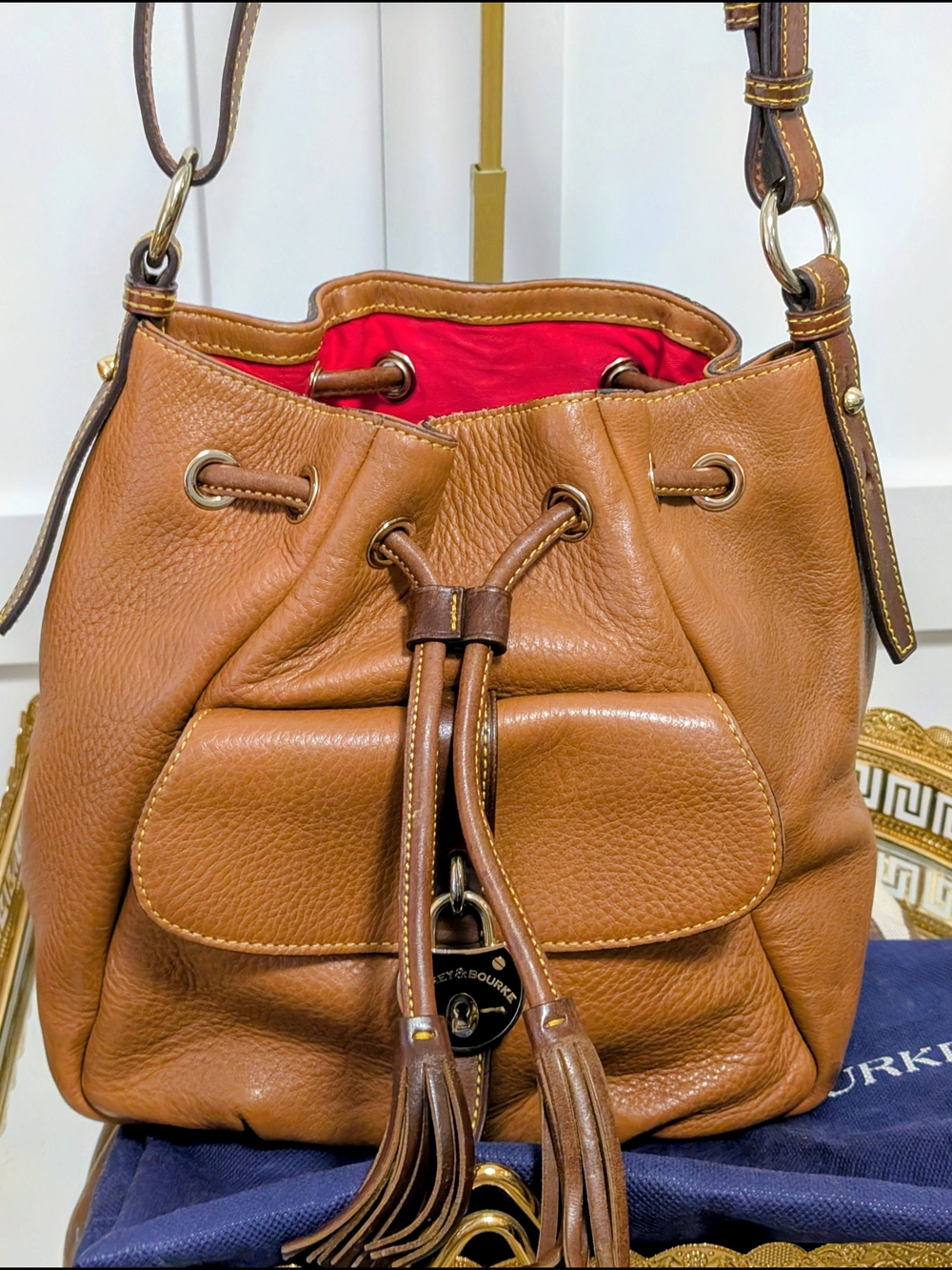 Dooney & Bourke Brown Leather Drawstring Crossbody Bag with Red Lining